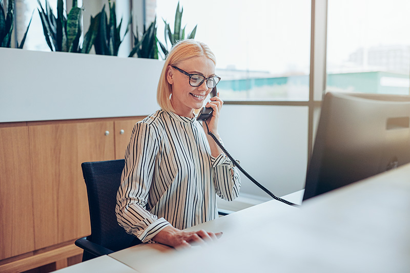 businesswoman-talking-on-a-telephone businesswoman-talking-on-a-telephone