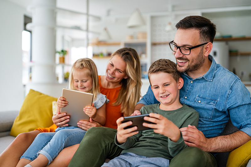 family-having-fun-devices-internet family-having-fun-devices-internet