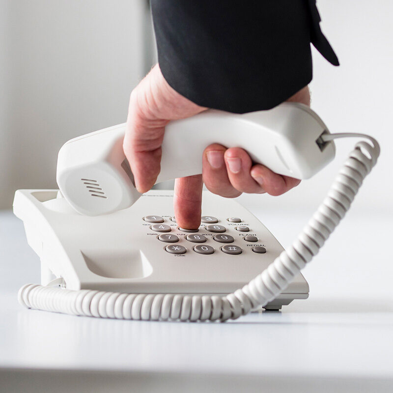 businessman-dialing-telephone