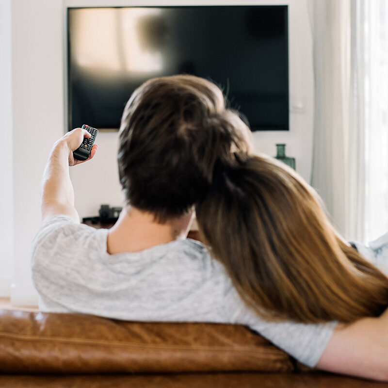 happy-couple-watching-tv